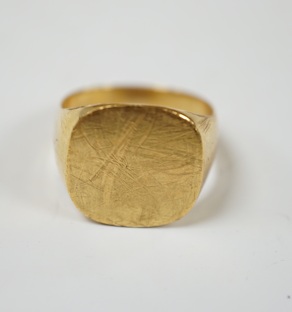 A 750 yellow metal signet ring, size N